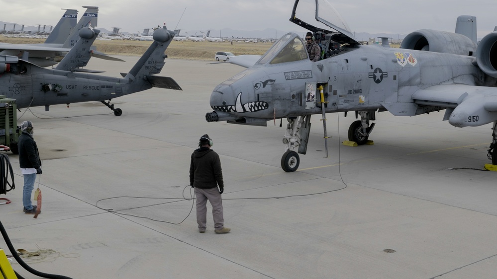 An aircraft mechanic starts the engine of an A-10 Thunderbolt at the 309th Aerospace Maintenance and Regeneration Group