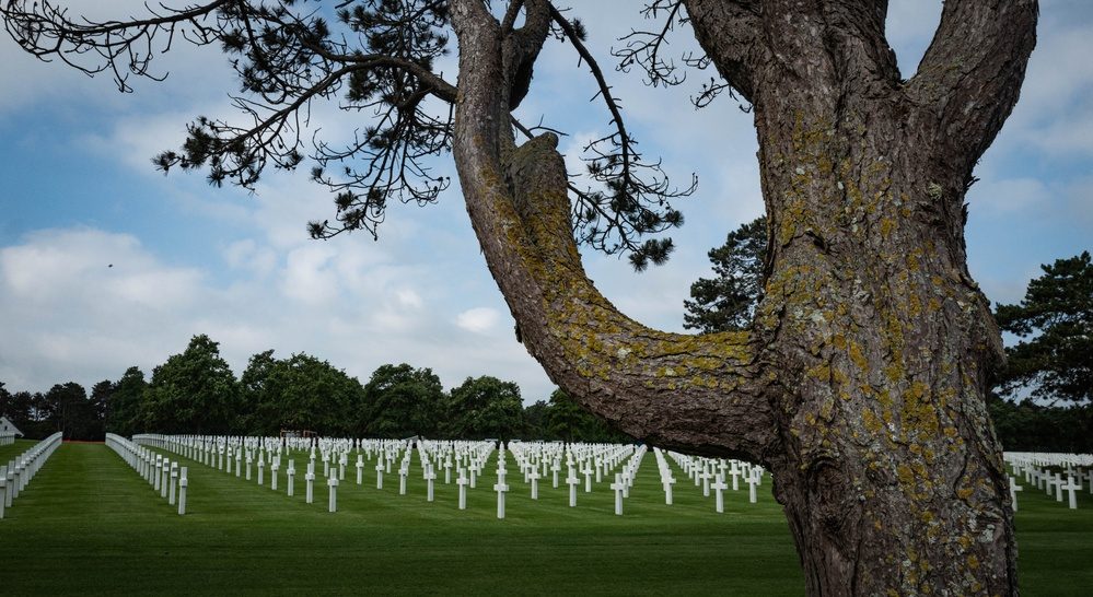 Military personnel attend a D-Day anniversary celebration at the Normandy American Cemetery