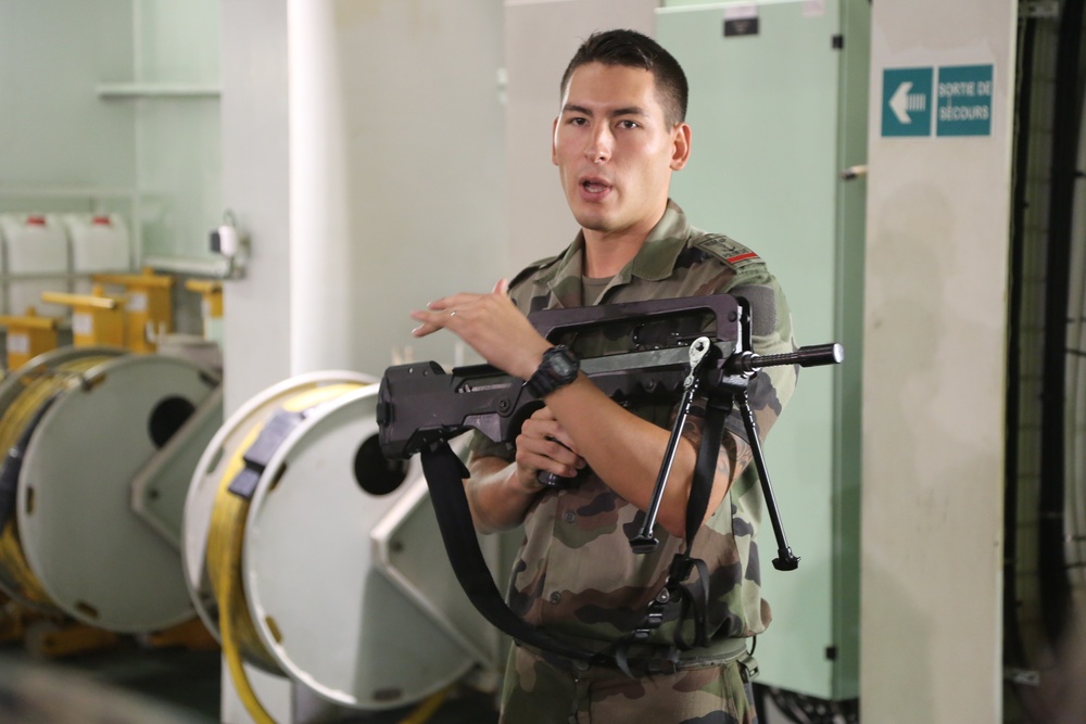Marine instructor demonstrates proper weapons handling and safety procedures