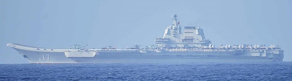 Chinese aircraft carrier Shandong underway in the South China Sea with escort warships
