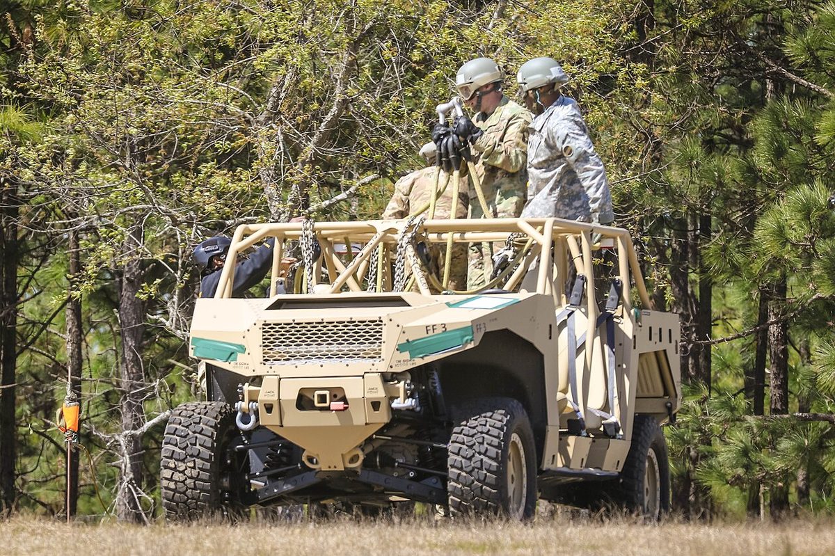 Polaris DAGOR ultra-light combat vehicle being prepared for loading onto a Black Hawk helicopter