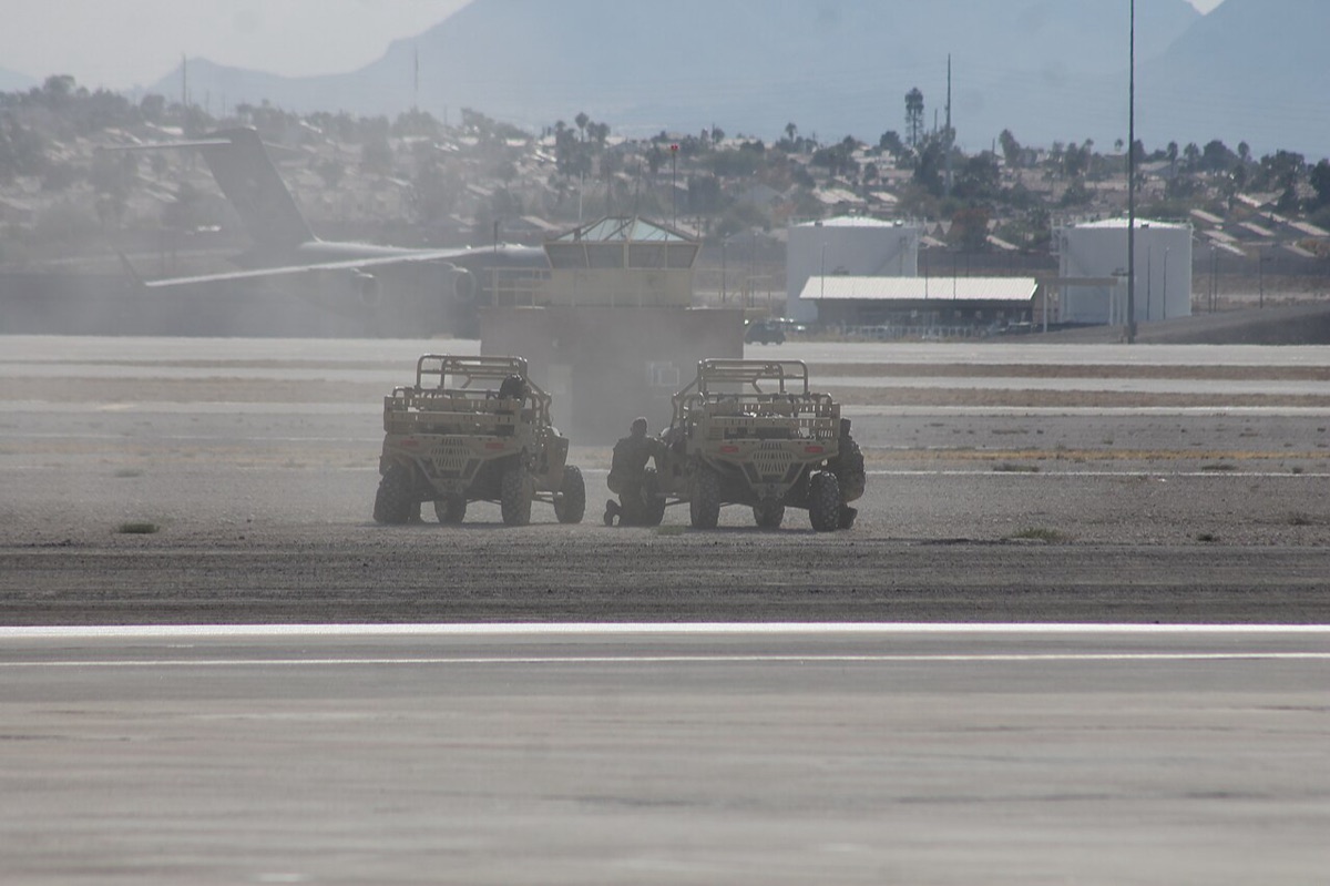 Polaris MRZR ultralight tactical vehicle being prepared for loading into a tiltrotor aircraft during a special operations exercise