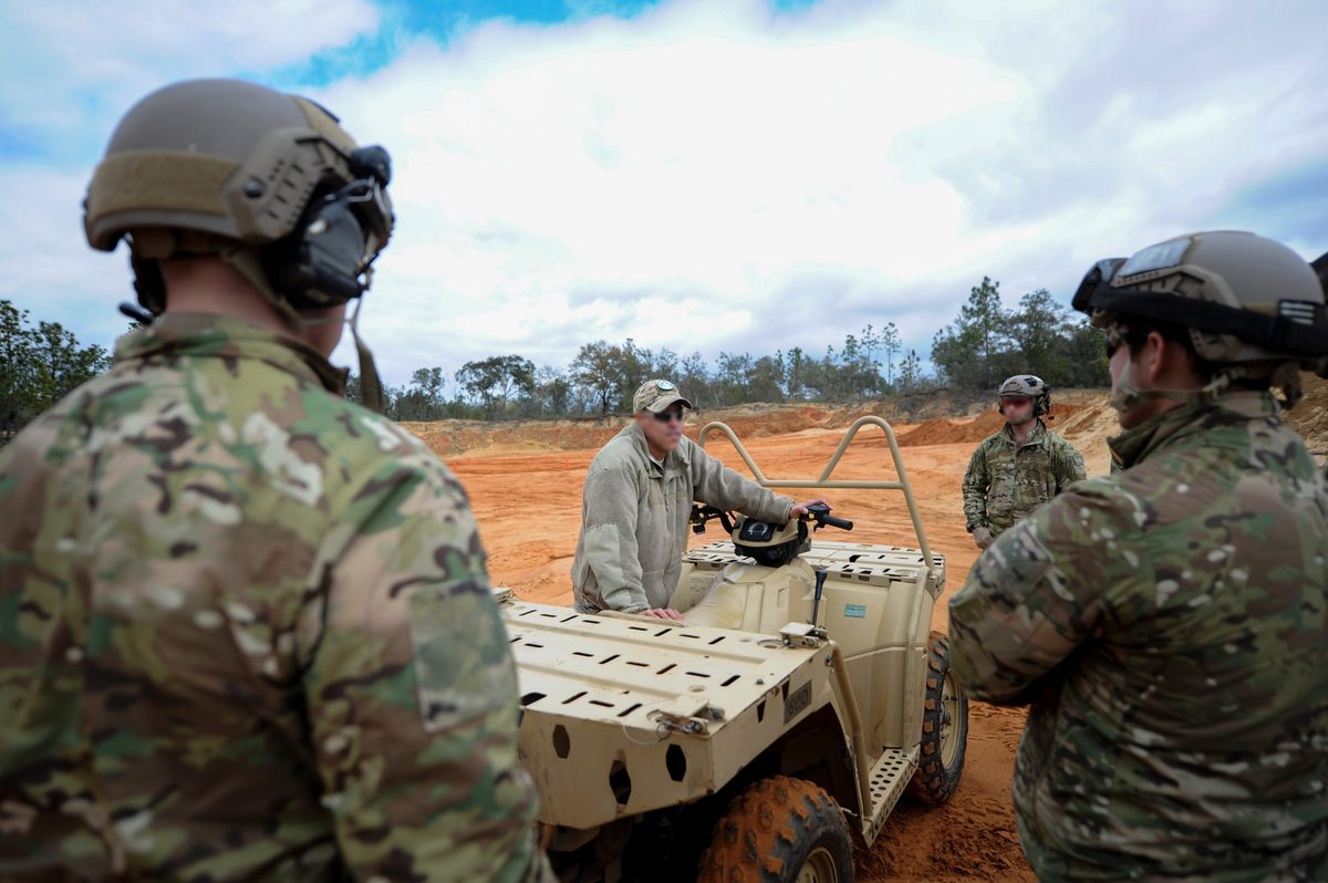Special operations soldiers with equipment during training operations using various tactical vehicles