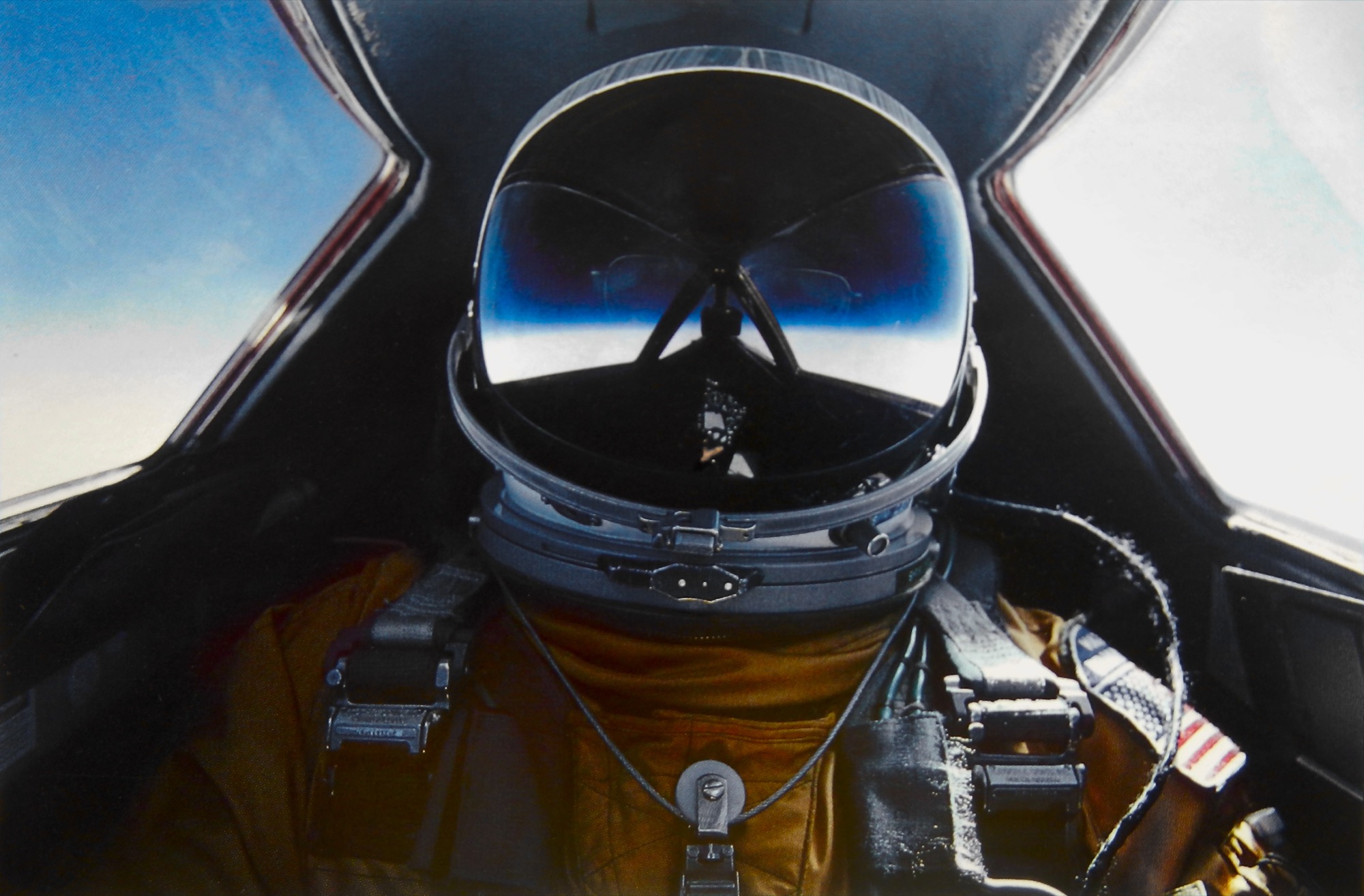 SR-71 Blackbird cockpit with flight instruments and pilot wearing a full pressure suit