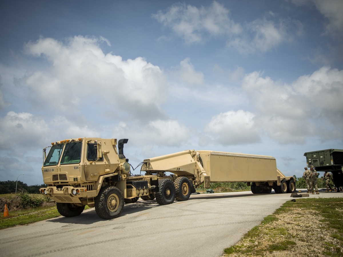 THAAD battery with launchers and support vehicles deployed in a defensive position