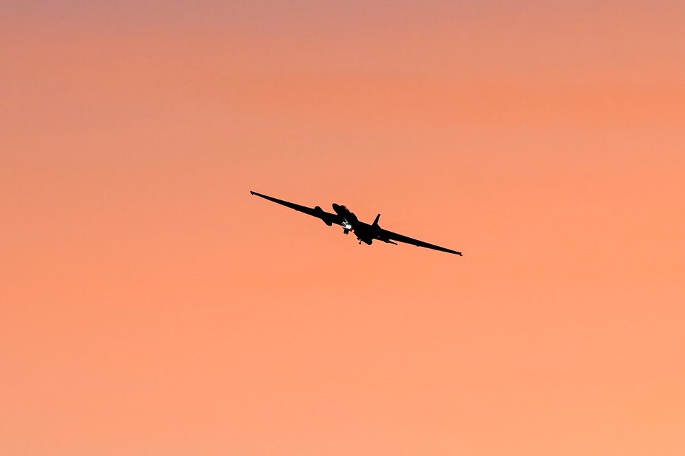 U-2 Dragon Lady silhouetted in flight at dusk