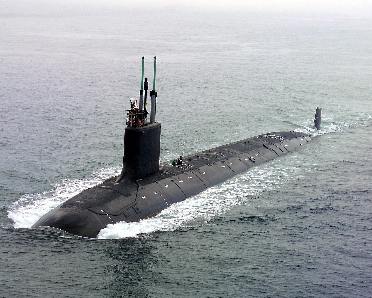 Virginia-class Block V nuclear attack submarine at sea showing the extended hull with Virginia Payload Module