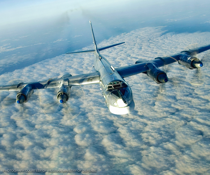 Tupolev Tu-95 Bear strategic bomber in flight showing its distinctive contra-rotating propellers