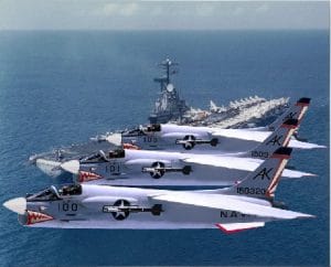 F-8 Crusaders Fly in Formation Over Carrier