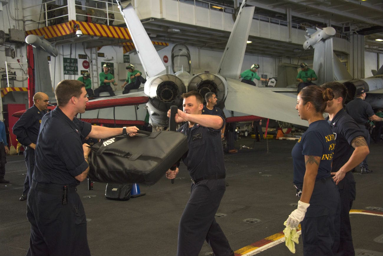 Navy men Close arms training aircraft carrier images