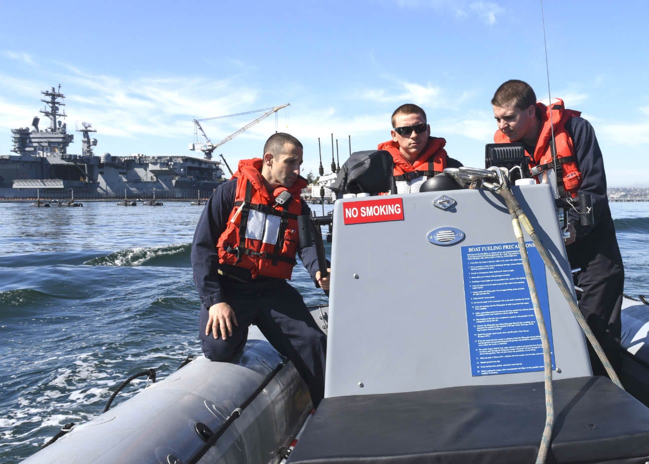 Sailmen leaving aircraft carrier