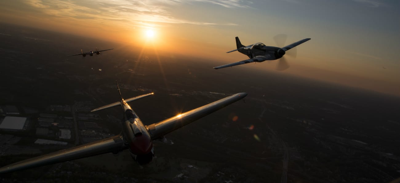 P-40 Warhawk, P-51 Mustang and a B-25 Mitchell fly over Joint Base Anacostia-Bolling