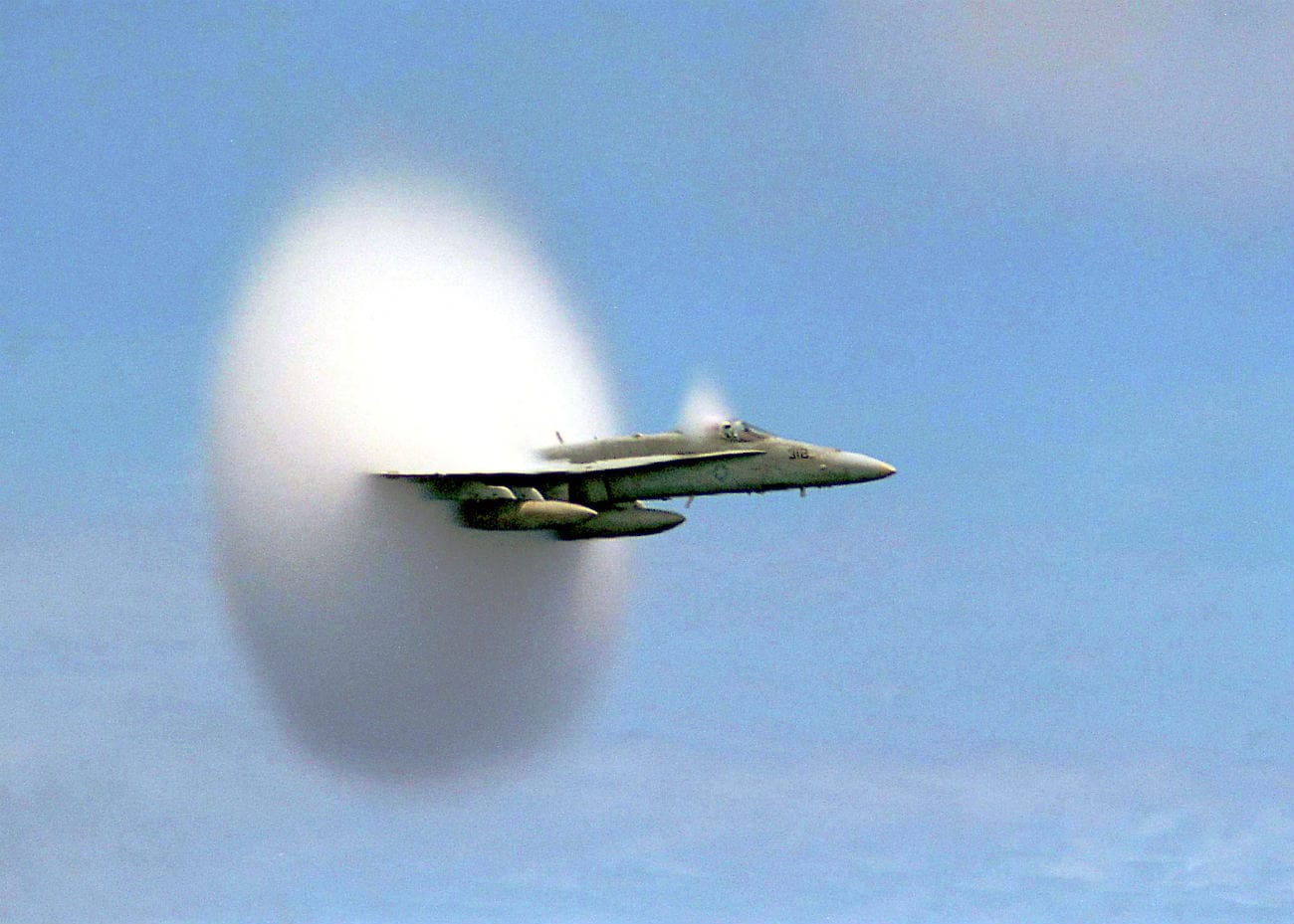 FA-18C Hornet breaking the sound barrier over the Pacific Ocean