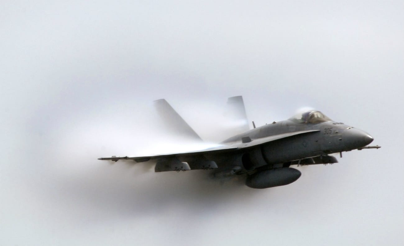FA-18C Hornet punching through a cloud of water vapor