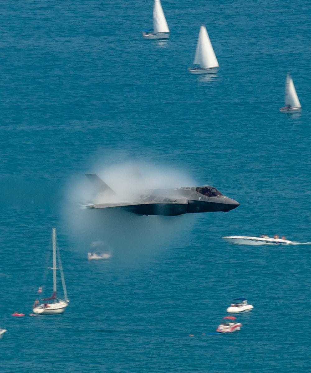 F-35 over sailboats