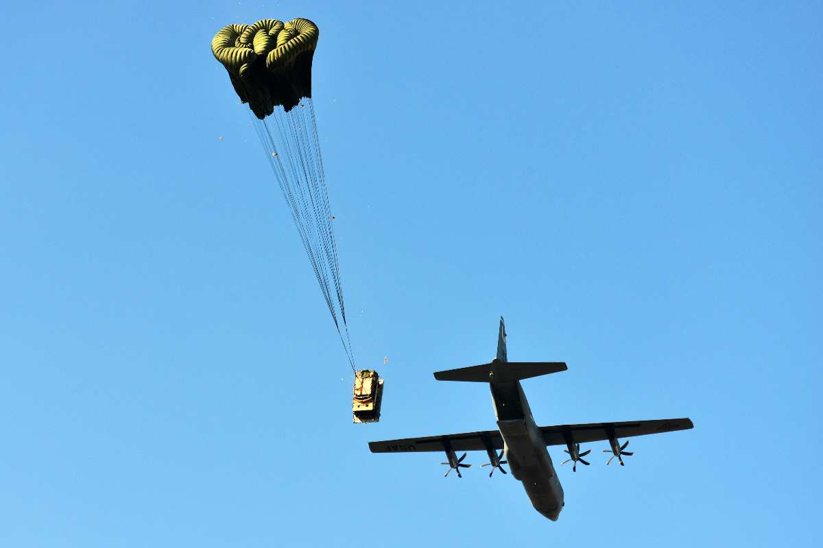 A U.S. Air Force 86th Air Wing C-130 Hercules airdrops a Humvee assigned to the 173rd Airborne Brigade Combat Team onto Frida IV Drop Zone in Pordenone, Italy, Jan. 21, 2016. 