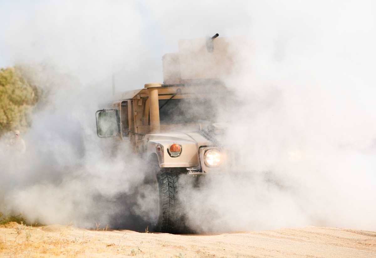 U.S. Marine Corps Humvee kicking up dust.