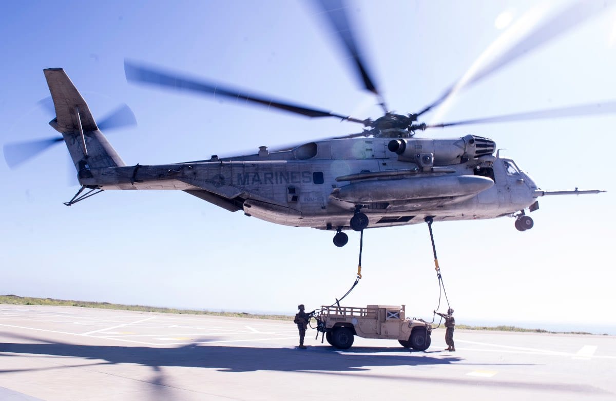 Humvee airlifted by helicopter