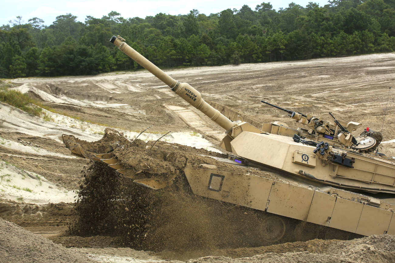 M1 Abrams tank through mud