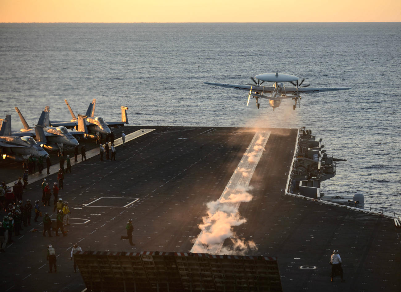 E-2 Hawkeye takes off sunset