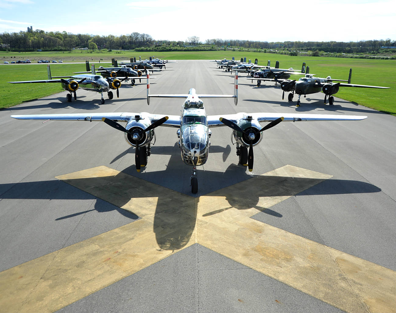 B-25 Mitchell bombers sit parked on the runway