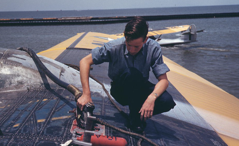 Sailor refueling a plane at the Naval Air Base